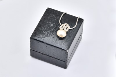 Lot 1860 - A VERSACE WHITE GOLD, DIAMOND AND MABE PEARL PENDANT