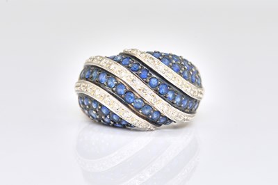 Lot 1884 - A 14CT WHITE GOLD, SAPPHIRE AND DIAMOND BOMBE RING
