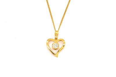 Lot 1918 - A GOLD AND DIAMOND HEART PENDANT WITH CHAIN
