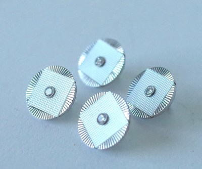 Lot 1954 - A SET OF FOUR WHITE GOLD, DIAMOND AND MOTHER-OF-PEARL DRESS BUTTONS (4)